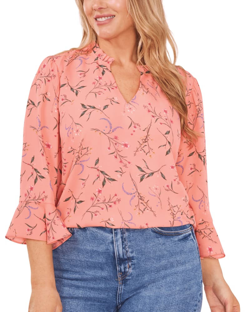 Front of a model wearing a size 1X Violet Ruffle V-Neck Blouse in CAMEO CORAL by CeCe. | dia_product_style_image_id:263504
